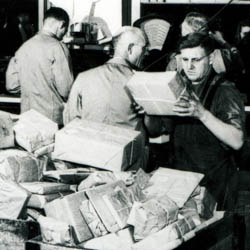 Sorting Parcels Behind Counter, ['ca. 1965']